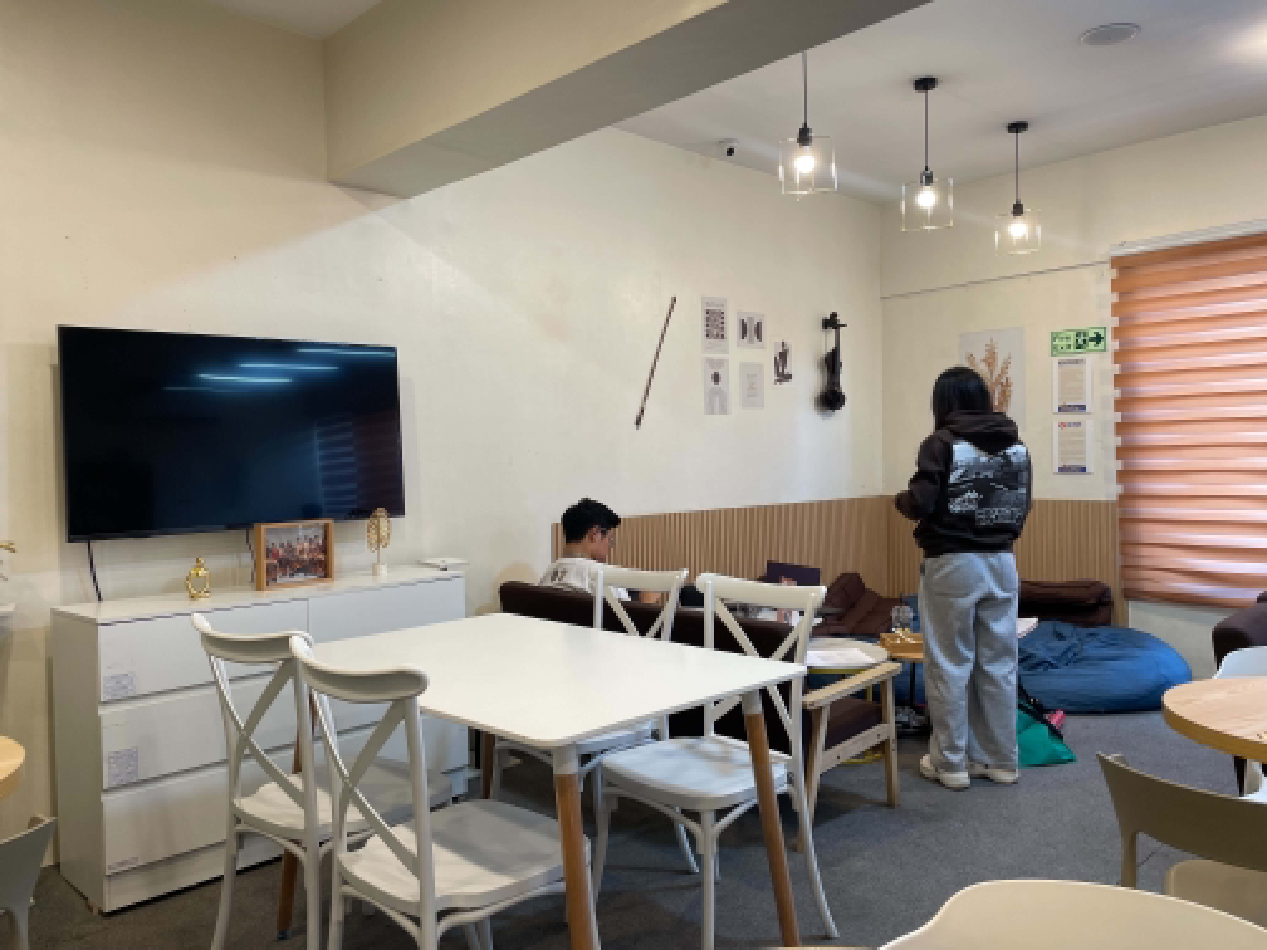 TV area with sofa and bean bag seating at WeeCup
