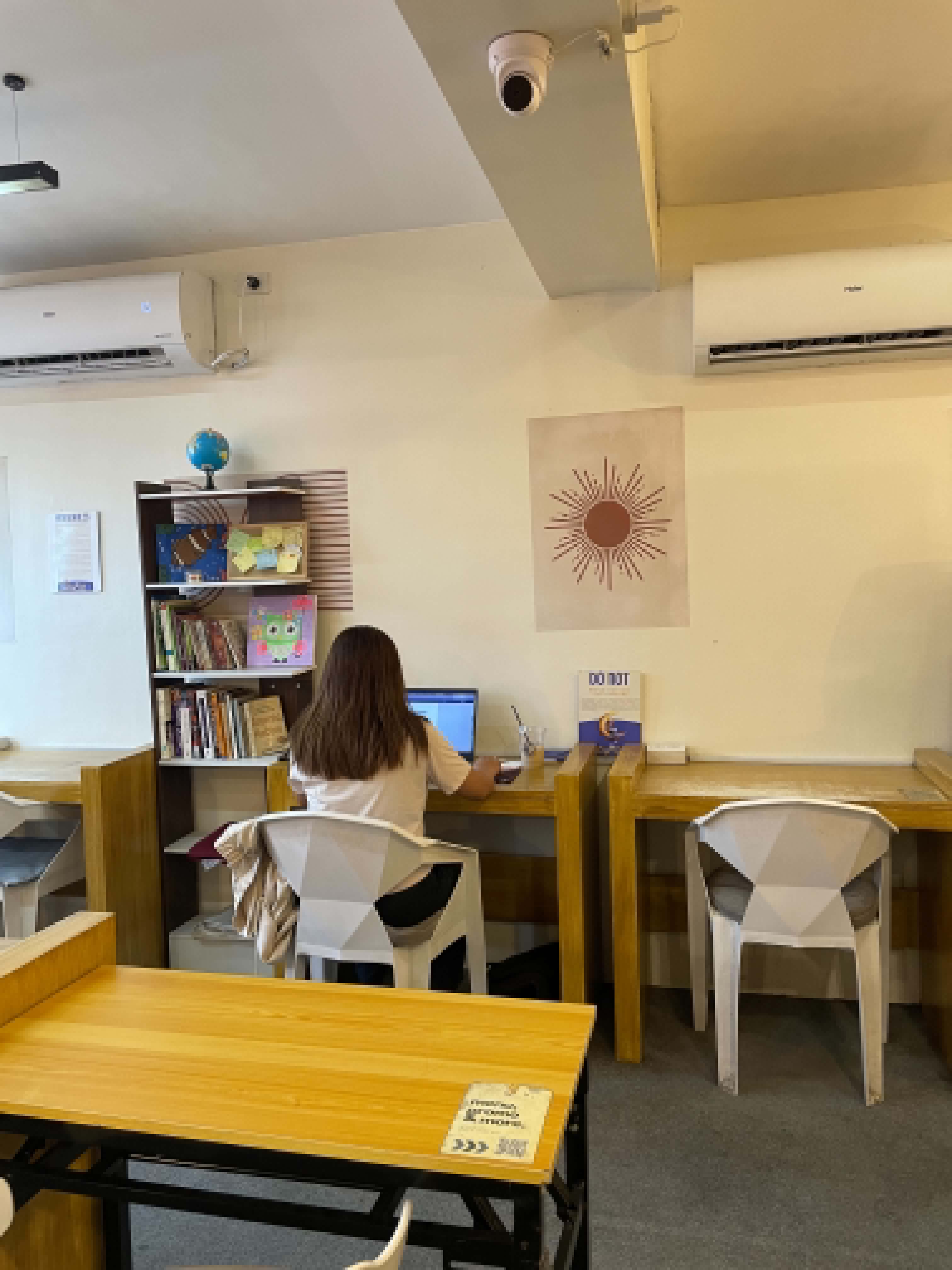 Quiet desk and TV wall seating inside WeeCup