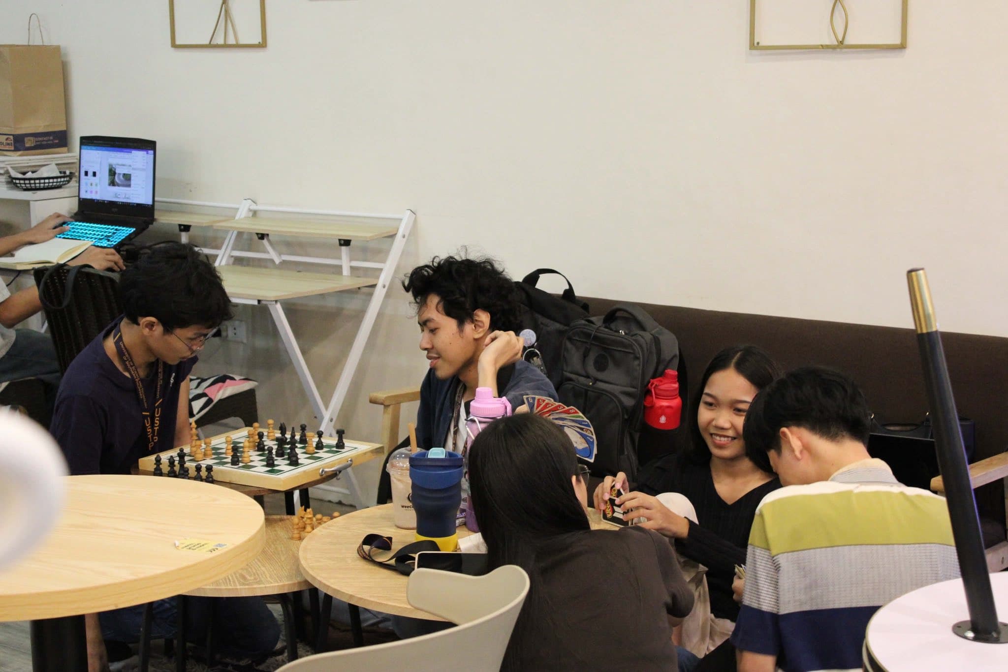 Customers playing board games around a round table