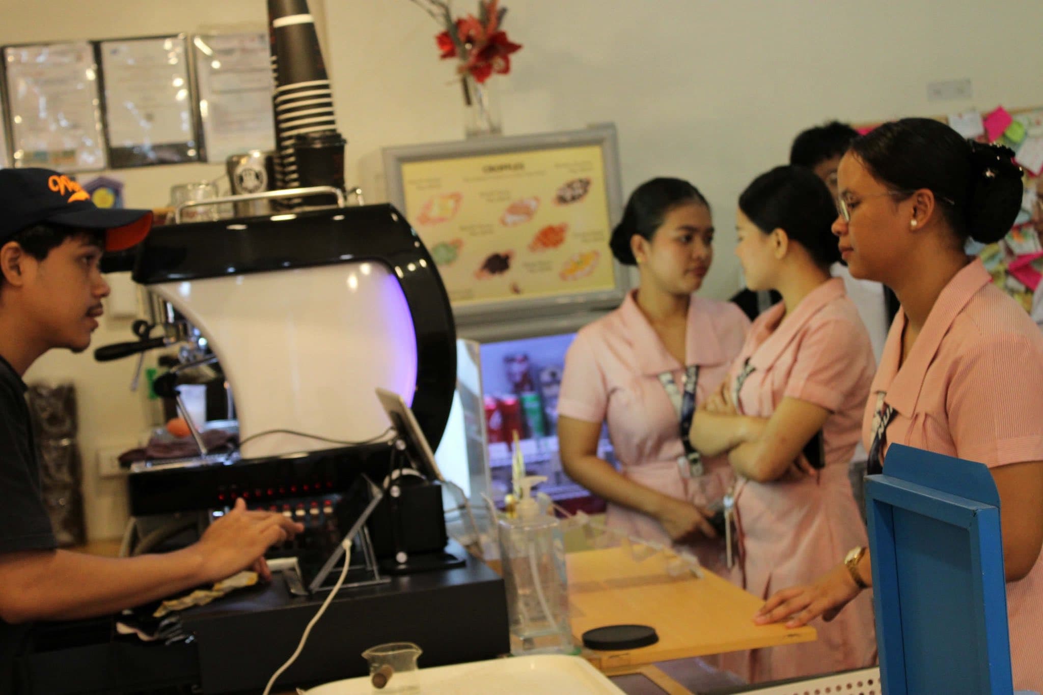 Customers being served at the WeeCup cafe counter